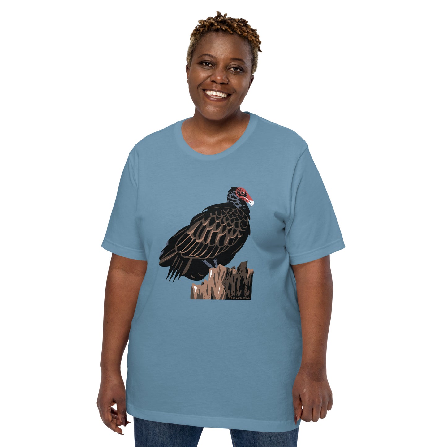 A woman modeling the blue majestic turkey vulture short-sleeved t-shirt.