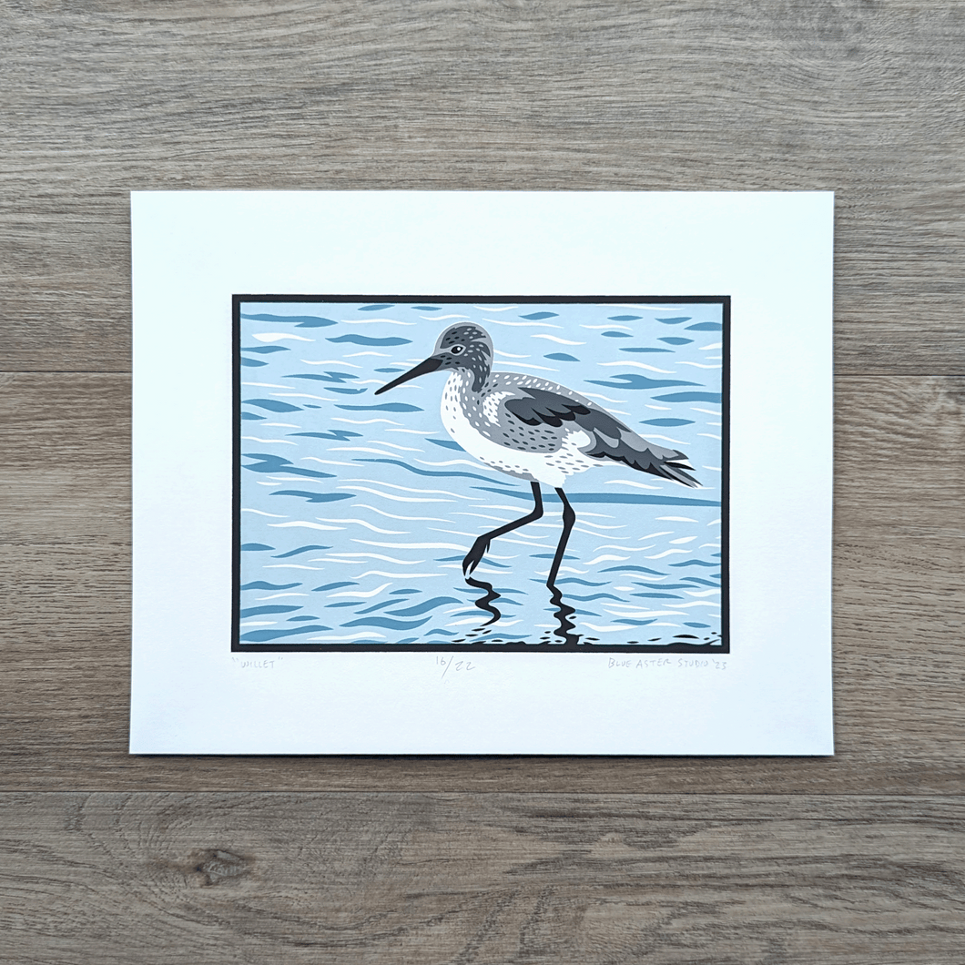 An original screen print of an illustration of a willet shorebird wading and foraging in shallow water.