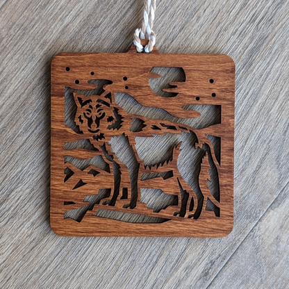 A brown wooden laser cut wolf ornament.