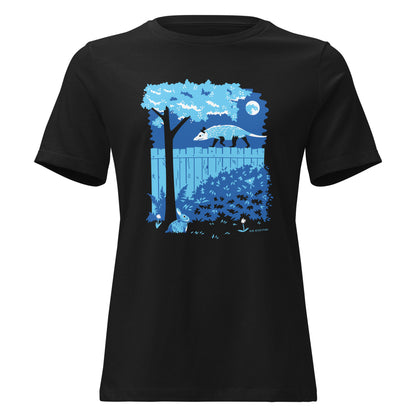 A black short-sleeved ladies cut t-shirt with an image of an opossum walking on a moonlit fence with a rabbit and a luna moth in the yard below.