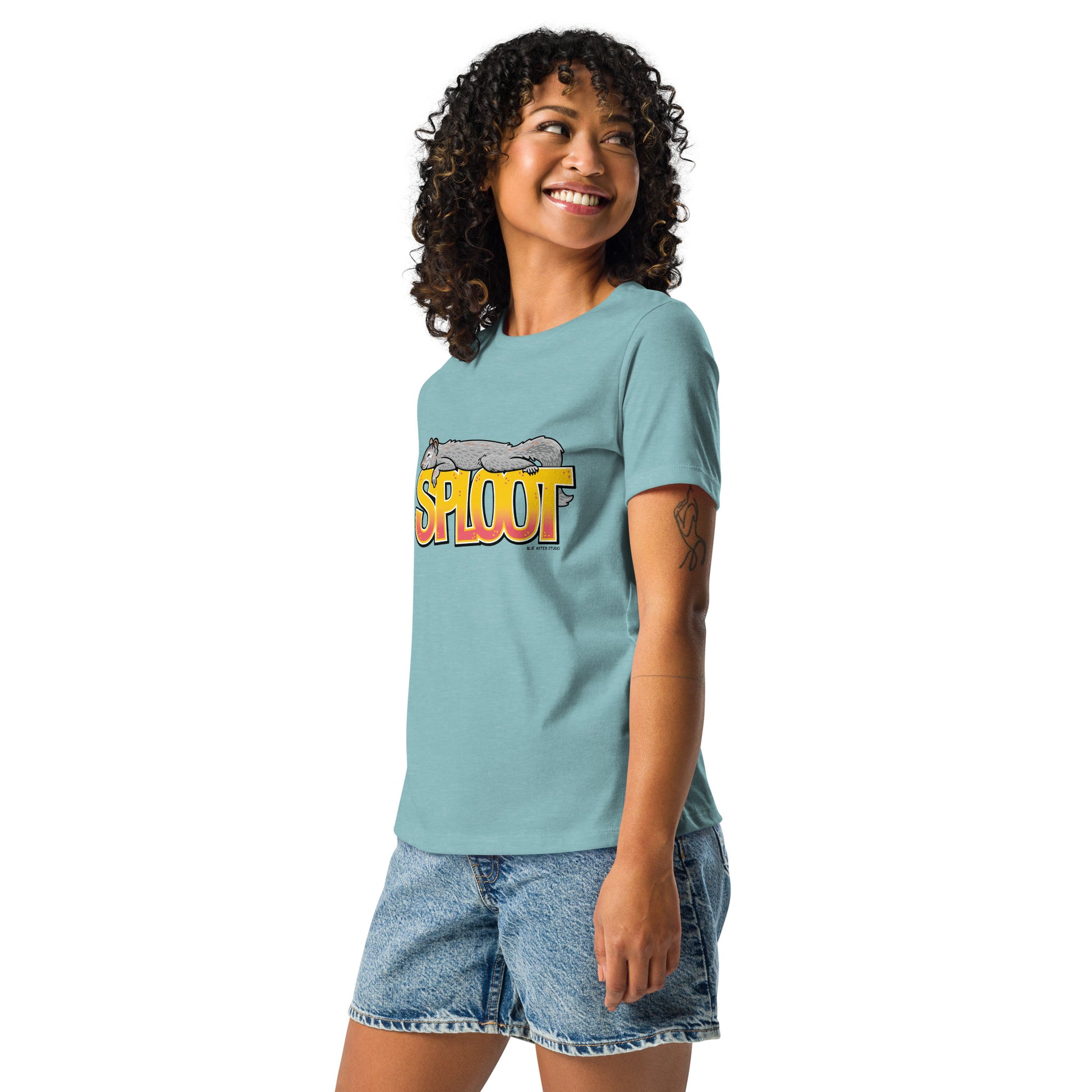 A woman modeling the heather blue short-sleeved squirrel sploot shirt.
