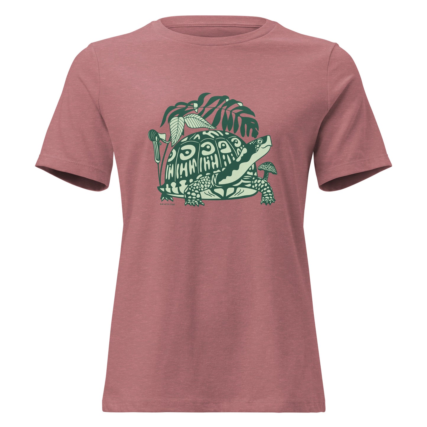 Heather mauve colored ladies t-shirt with a design of a box turtle surrounded by North American woodland plants.