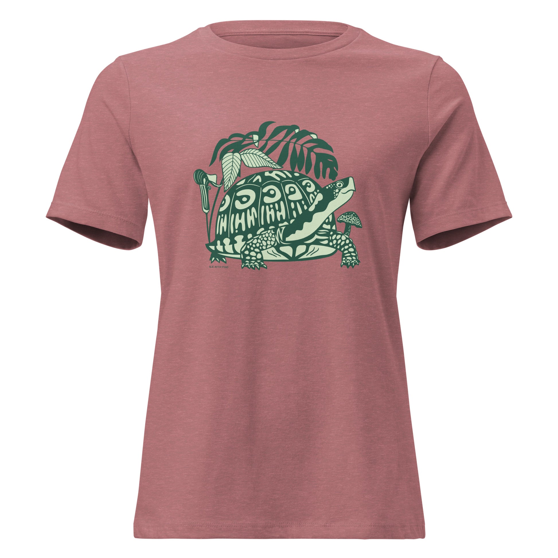Heather mauve colored ladies t-shirt with a design of a box turtle surrounded by North American woodland plants.