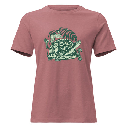 Heather mauve colored ladies t-shirt with a design of a box turtle surrounded by North American woodland plants.