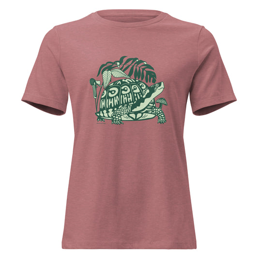 Heather mauve colored ladies t-shirt with a design of a box turtle surrounded by North American woodland plants.