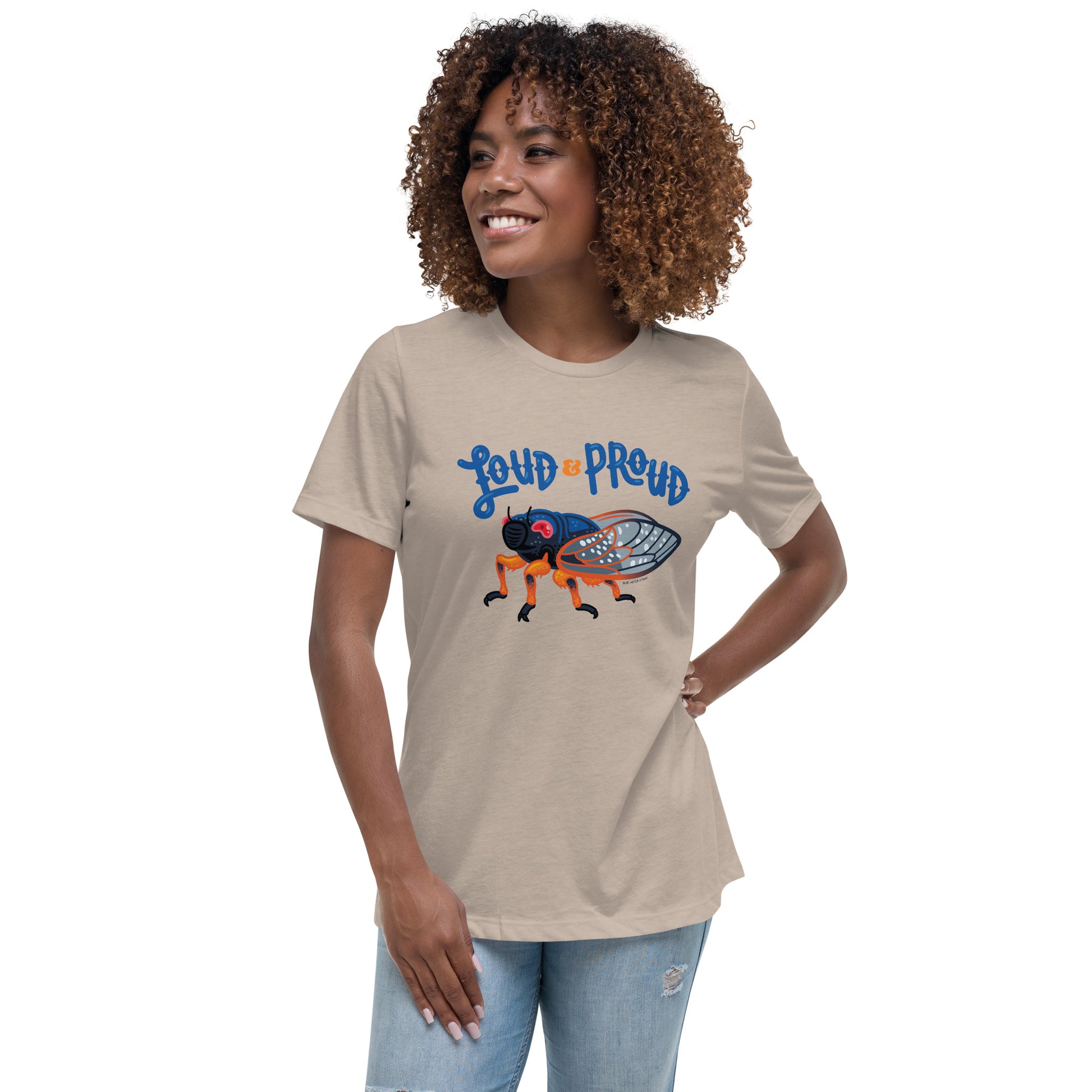 A woman is modeling the heather stone cicada t-shirt.