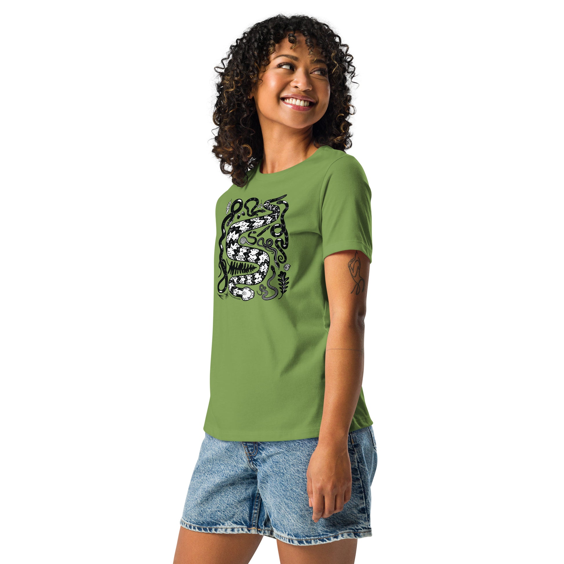 A woman in the green seven snakes short-sleeved t-shirt.