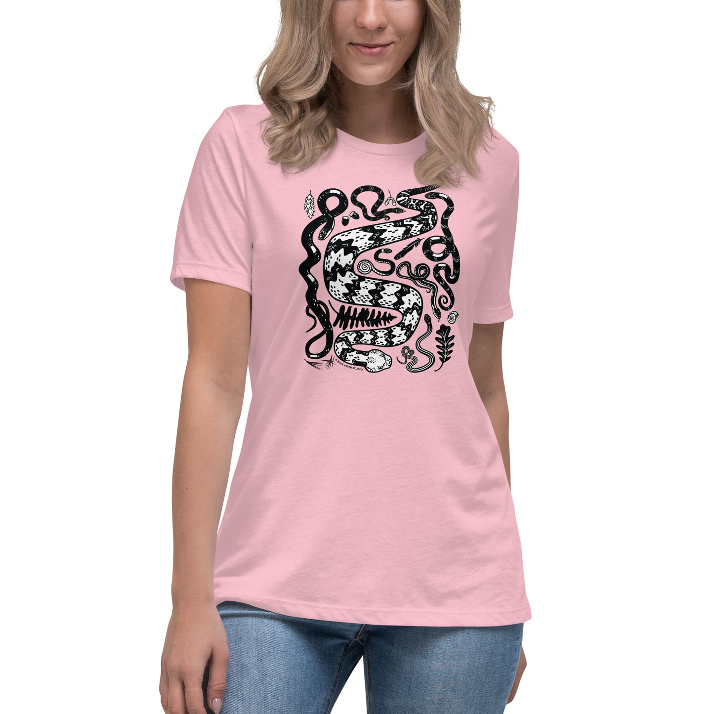 A woman wearing the pink seven snakes short-sleeved t-shirt.