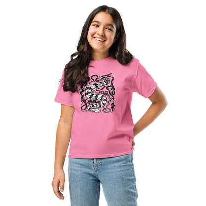 A young girl wearing a pink seven snakes t-shirt.