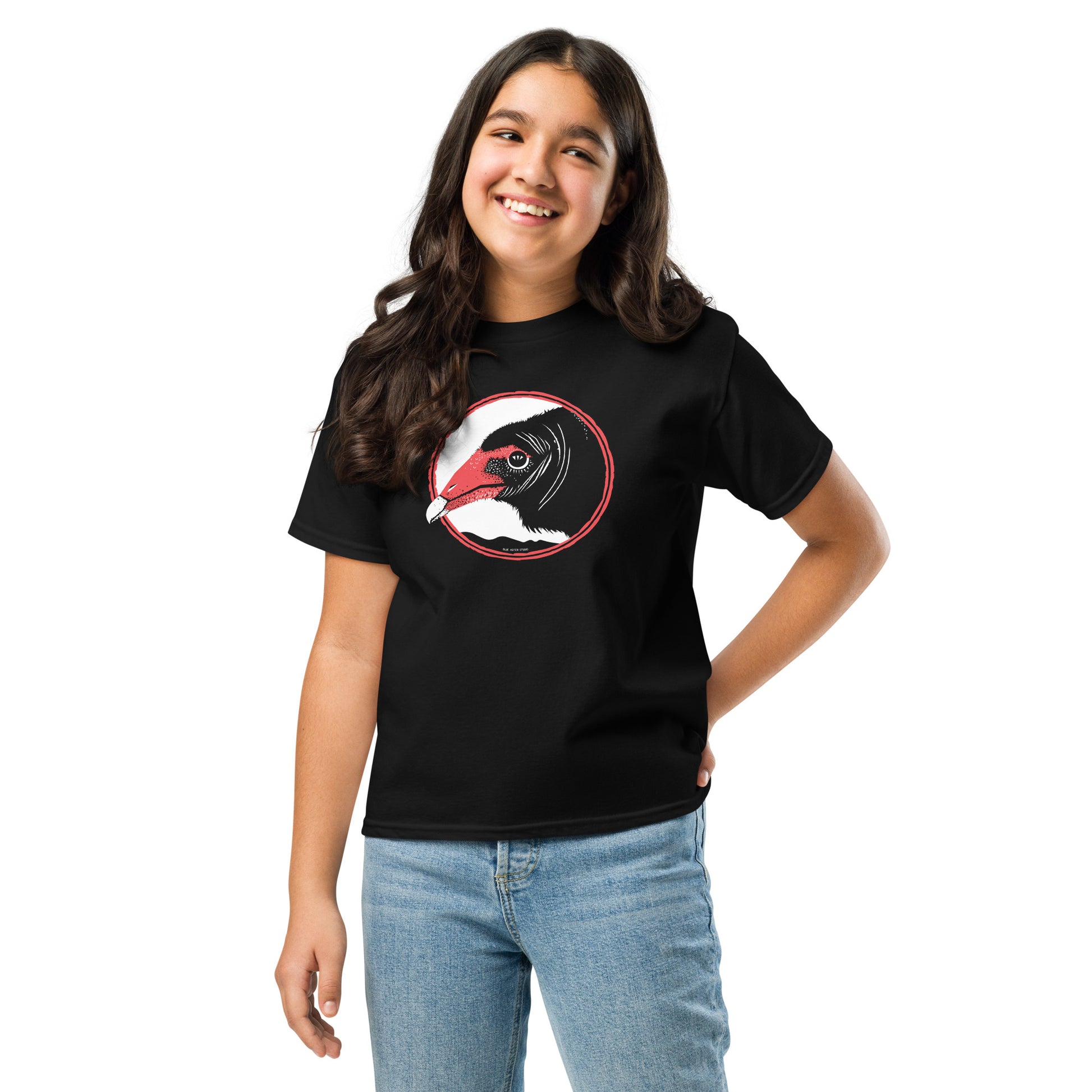 A tween girl wearing the turkey vulture t-shirt.