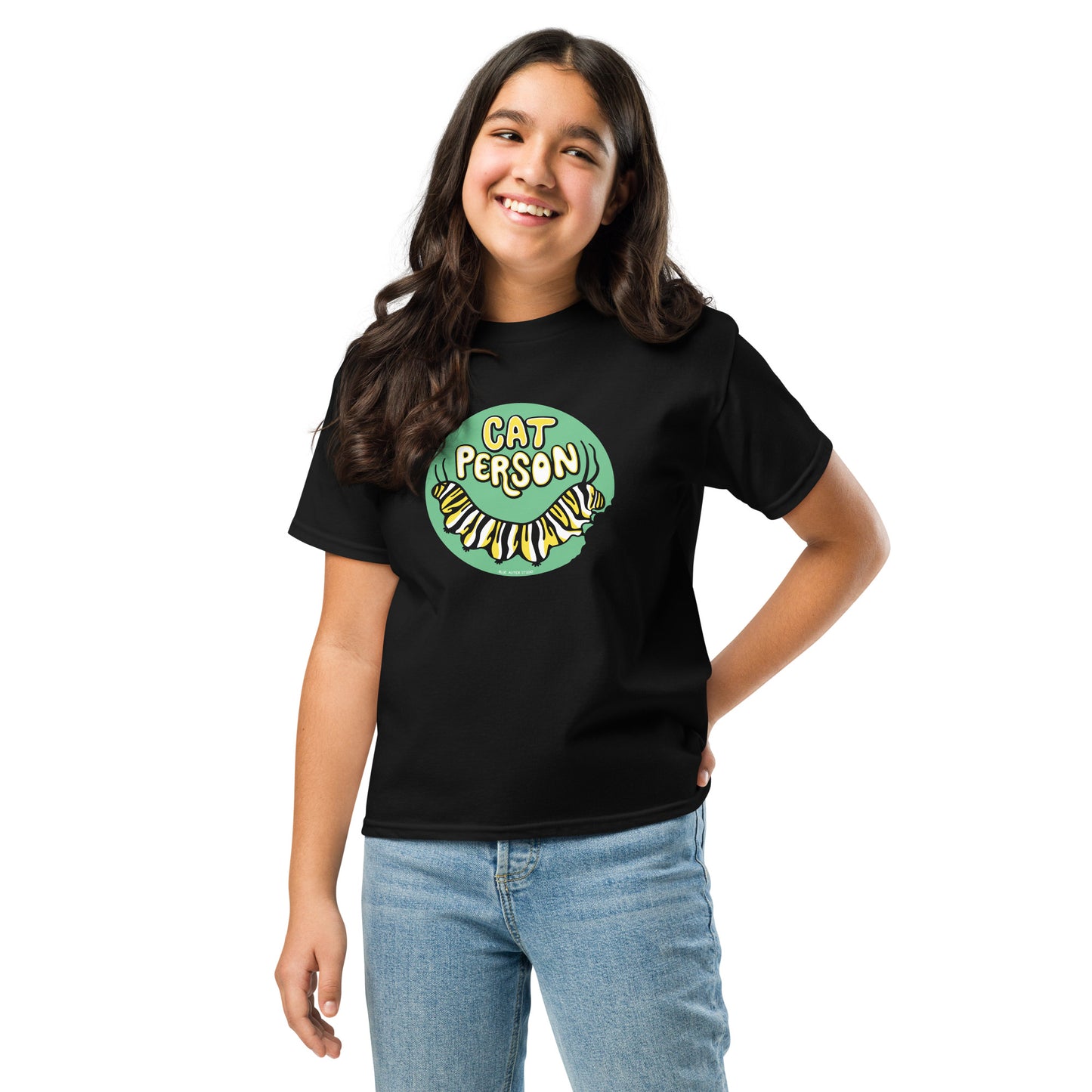 A young girl wearing the cat person monarch butterfly caterpillar tee.