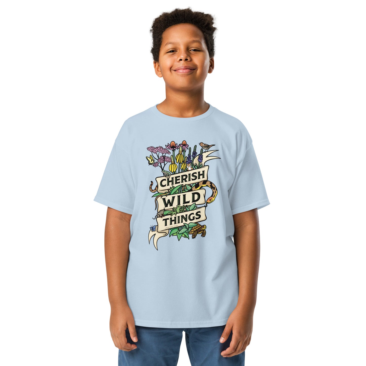 A young boy modeling the Cherish Wild Things light blue tee.