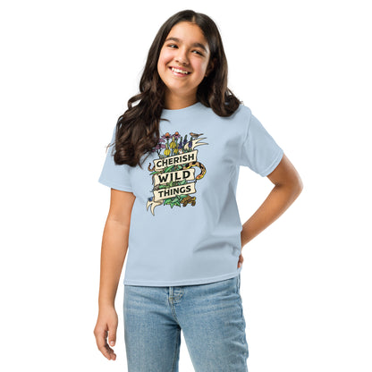A young girl modeling the Cherish Wild things light blue tee.