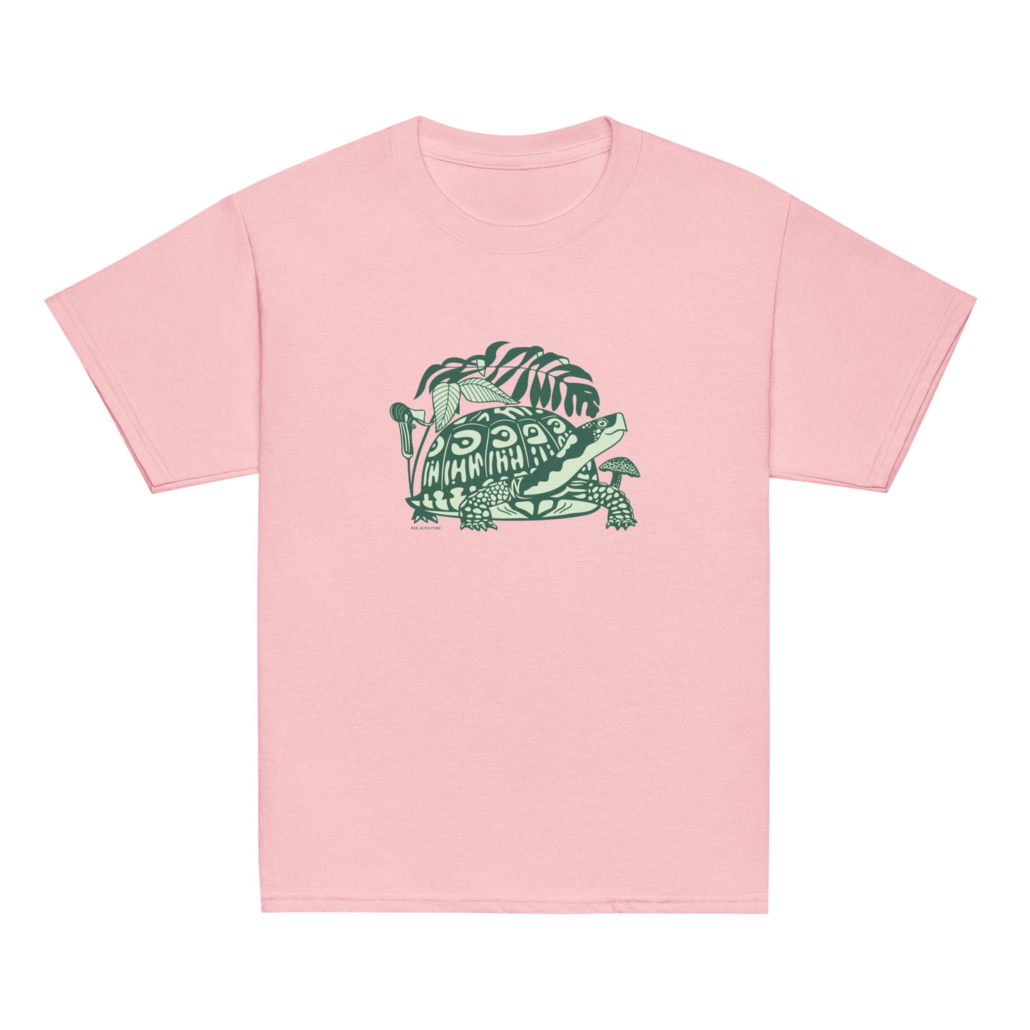 A pink youth-sized t-shirt with a design of a happy box turtle surrounded by native North American woodland plants.