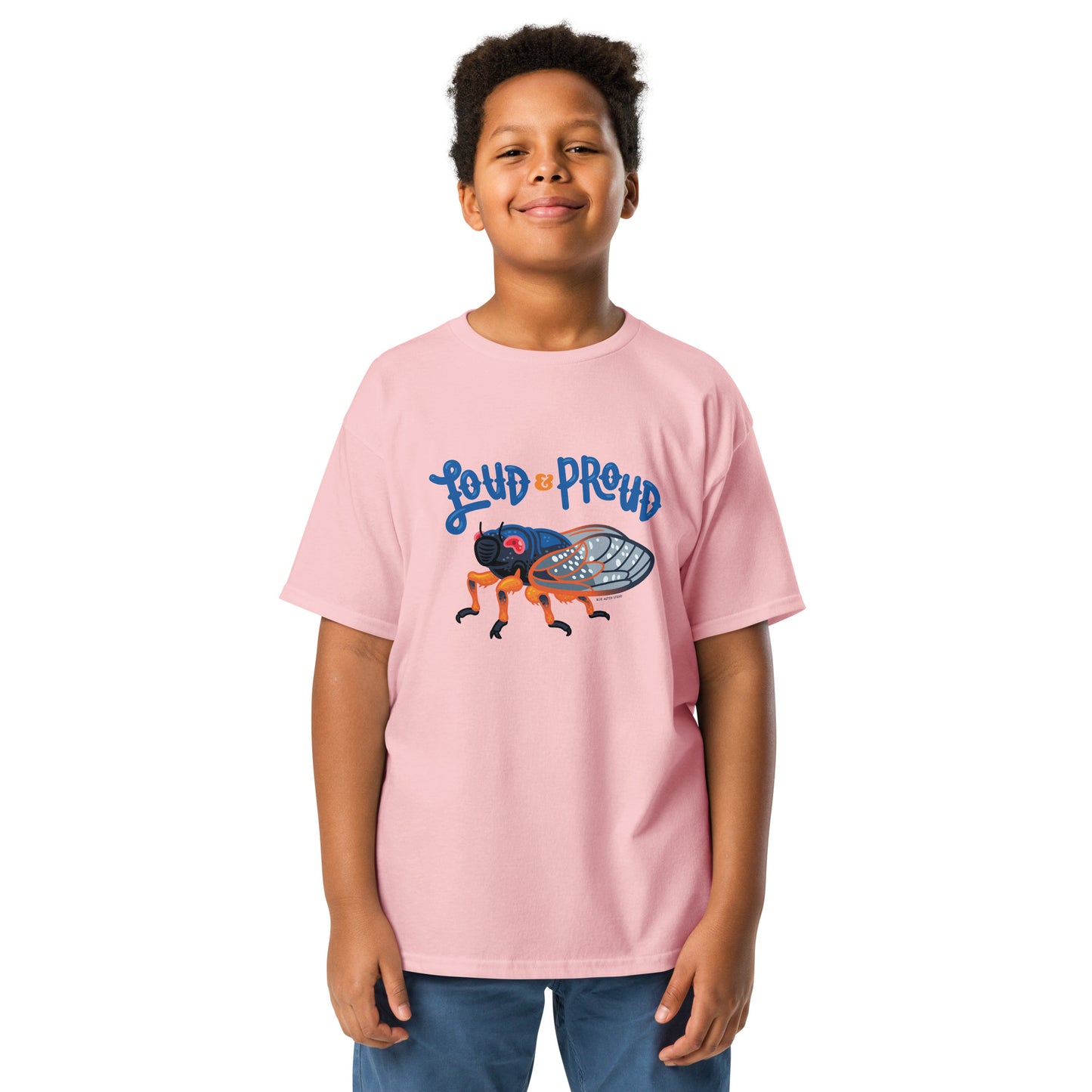 A young boy modelling the pink cicada tee