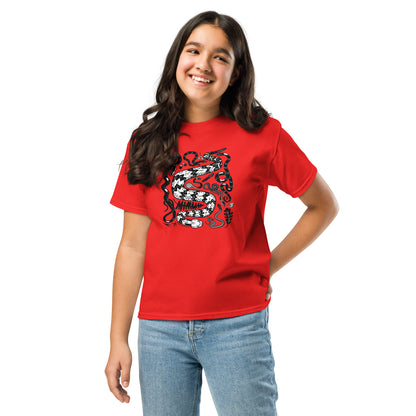A young tween girl wearing a red seven snakes shirt.