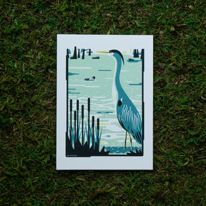 An art print of a heron in a swampy wetland.