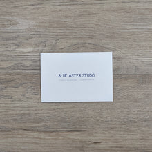 Load image into Gallery viewer, The back of the opossum card showing the Blue Aster Studio logo, website address, and that the cards are printed on recycled paper.