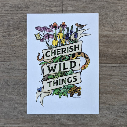 A botanical illustration of a collection of prairie plants such as Joe Pye weed, purple coneflower, vervain, and tall headed cone flower as well as critters commonly found in the prairie such as a snake, turtle, butterfly, bird, frog, chipmunk, vole, and lizard. They are all wrapped in a ribbon that has the words "Cherish Wild Things"