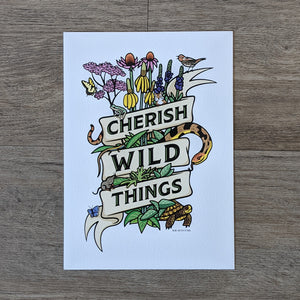 A botanical illustration of a collection of prairie plants such as Joe Pye weed, purple coneflower, vervain, and tall headed cone flower as well as critters commonly found in the prairie such as a snake, turtle, butterfly, bird, frog, chipmunk, vole, and lizard. They are all wrapped in a ribbon that has the words "Cherish Wild Things"
