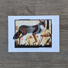 Load image into Gallery viewer, A 5x7 art print of a coyote in the underbrush of a woodland setting. Printed in grays, browns, and black.