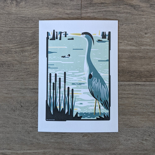 An art print of a great blue heron standing in a wetland.
