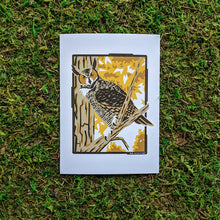 Load image into Gallery viewer, An art print of an illustration of a great horned owl perched in a tree surrounded by fall folliage.