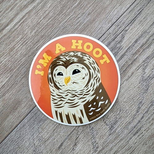 A vinyl sticker with an illustration of a barred owl and the words 