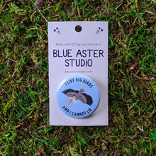Load image into Gallery viewer, A 1.5&quot; pinback button with an illustration of a great blue heron on a light blue background and the words &quot;I Like Big Birds And I Cannot Lie&quot;