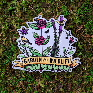 A vinyl sticker with illustrations of plants such as milkweed, liatris, bee balm, and echinacea with critters all around them including birds, butterflies, and other insects. At the bottome of the sticker there is a banner that reads "Garden For Wildlife"
