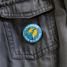 Load image into Gallery viewer, A 1.5 inch &quot;I Garden For Wildlife&quot; button pinned to a gray canvas jacket.
