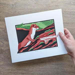 The 8x10 least weasel original screen print held in a hand to help show scale.