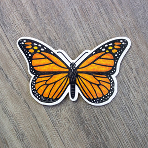 A vinyl sticker of a monarch butterfly.