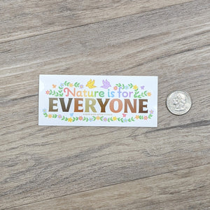 Nature Is For Everyone sticker next to a USD quarter for scale