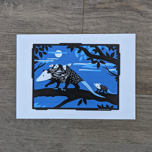 An art print of a mama opossum carrying her babies on a moonlit tree branch.