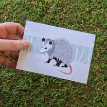 Load image into Gallery viewer, A hand holding an opossum greeting card.