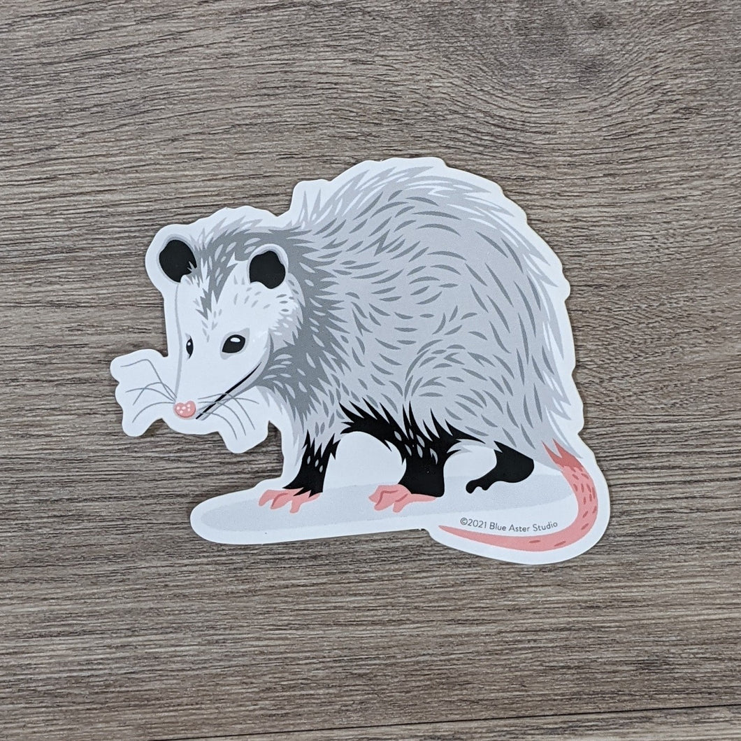 A cute vinyl sticker of an illustrated opossum.