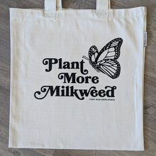 Load image into Gallery viewer, A monarch butterfly tote bag with the words &quot;Plant More Milkweed&quot; and a monarch butterfly printed on it.