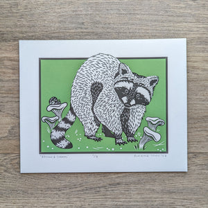 An illustration of a raccoon in a patch of chanterelle mushrooms with a green background. This is an original Blue Aster Studio screen print that is signed and numbered.
