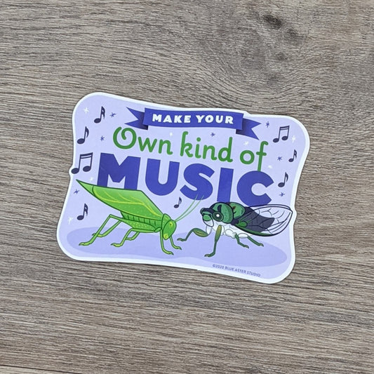 A vinyl sticker featuring illustrations of a katydid and cicada and the words "Make Your Own Kind Of Music"