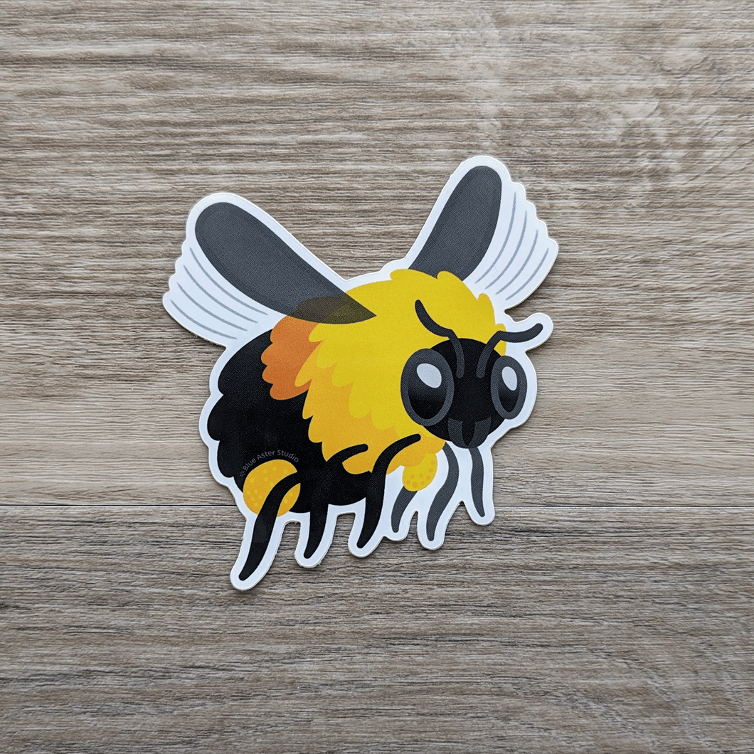 A vinyl sticker of an illustration of a bumblebee in flight.