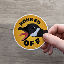 Load image into Gallery viewer, A hand holding the Honked Off Goose sticker.