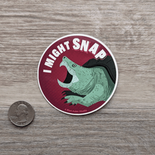 Load image into Gallery viewer, The snapping turtle sticker next to a USD quarter to show scale.