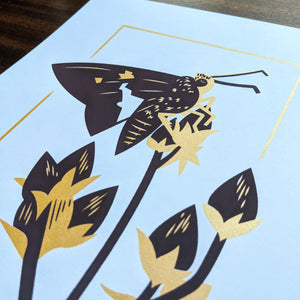A close-up of the screen print showing the slight shine from the gold ink.